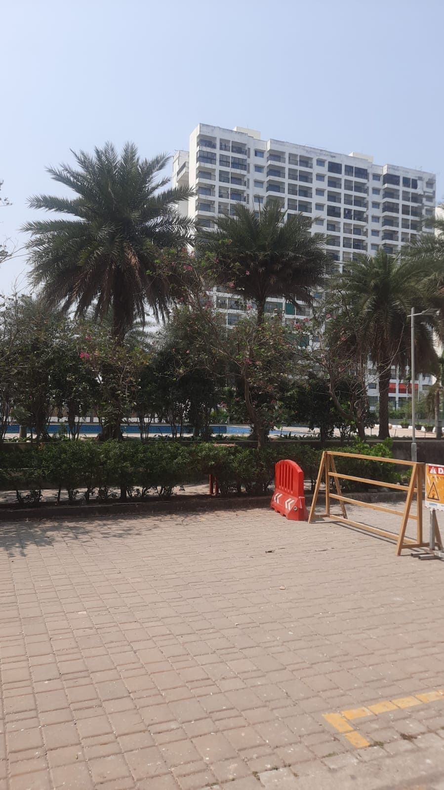 Wide view of Godrej Palmgrove towers with landscaping