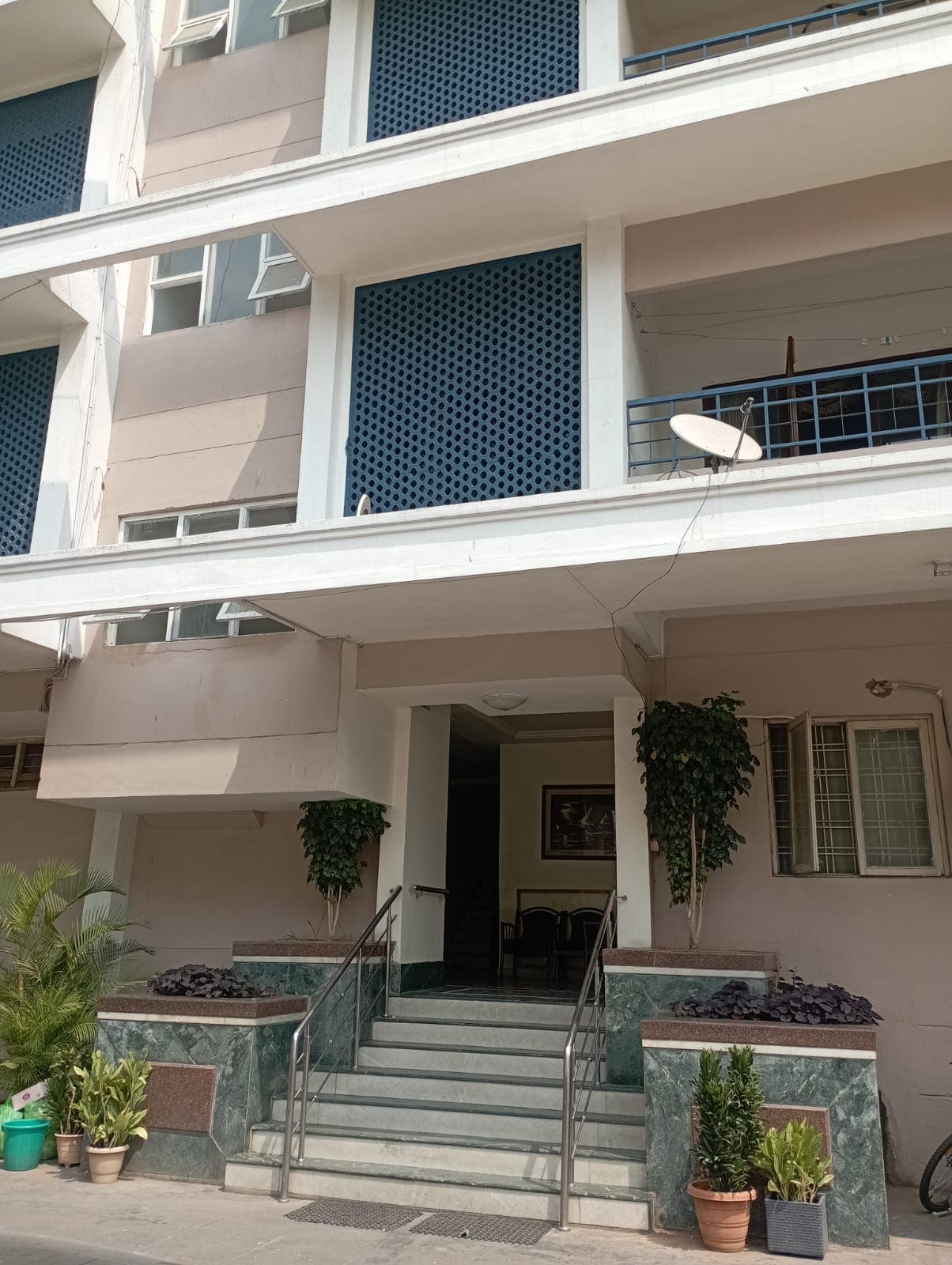 Ground-level view with landscaping at Asafjahi Towers