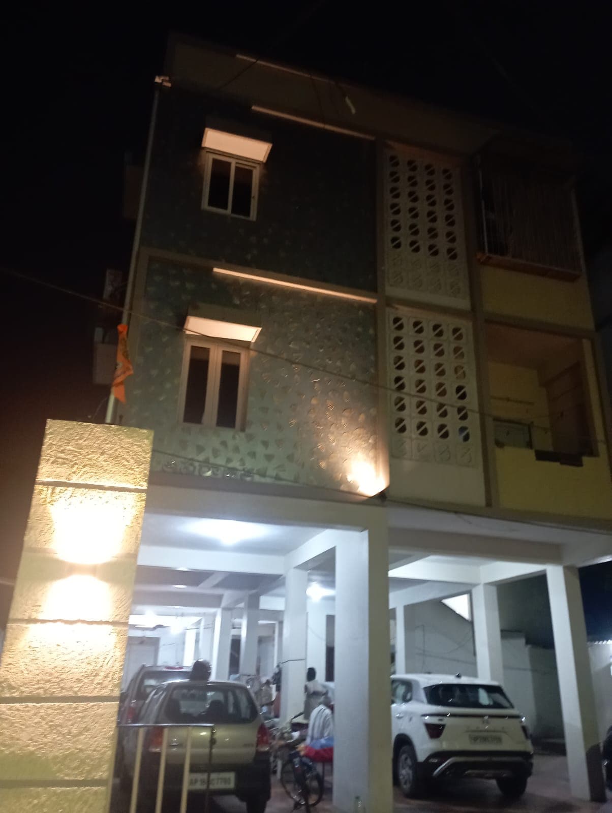 Side perspective of Aparajita Homes at night